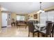 Open concept living room with comfortable sofas and dining area, great for entertaining at 156 Bristol Forest Trl, Sanford, FL 32771