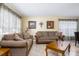Cozy living room with comfortable sofas, neutral paint, and a well lit space at 156 Bristol Forest Trl, Sanford, FL 32771