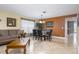 Cozy living room featuring tile floors, a dining set, and neutral tones creating a welcoming space at 156 Bristol Forest Trl, Sanford, FL 32771