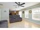 Living room with tile flooring and natural light, flowing into the kitchen and dining areas at 156 Bristol Forest Trl, Sanford, FL 32771