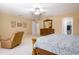 This spacious bedroom features a ceiling fan, walk-in closet, and seating area at 156 Bristol Forest Trl, Sanford, FL 32771