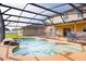 Backyard pool featuring an attached spa area and a screened-in lanai, perfect for entertaining at 156 Bristol Forest Trl, Sanford, FL 32771