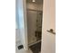 Modern bathroom featuring a glass-enclosed shower with a bench at 15929 Moonlight Bay St, Winter Garden, FL 34787
