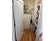 Walk-in closet featuring built-in shelving, drawers and hardwood floor at 15929 Moonlight Bay St, Winter Garden, FL 34787