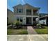 Charming two-story home featuring a welcoming front porch and well-manicured landscaping at 15929 Moonlight Bay St, Winter Garden, FL 34787
