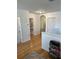 Hallway featuring hardwood floors, neutral walls, and access to multiple bedrooms at 15929 Moonlight Bay St, Winter Garden, FL 34787