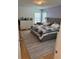 Cozy main bedroom featuring a plush bed and ample natural light from two large windows at 15929 Moonlight Bay St, Winter Garden, FL 34787