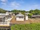 Aerial view of the property with metal roof and small dock at 1626 Salmon St, St Cloud, FL 34771