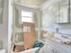 Bathroom with a white vanity and bathtub in need of repair and remodel at 1626 Salmon St, St Cloud, FL 34771