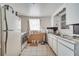 Old kitchen showcasing basic appliances and cabinetry, ready for refurbishment at 1626 Salmon St, St Cloud, FL 34771