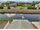 Waterfront homes with a canal view and green lawns at 1626 Salmon St, St Cloud, FL 34771