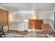 Room with partial wood paneling, debris, and covered window in need of TLC at 1626 Salmon St, St Cloud, FL 34771