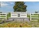 A welcoming sign to the Magnolia Pointe community surrounded by well manicured landscape at 175 Flag Lilly Ln, Umatilla, FL 32784