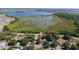 Discover this property from an aerial view, ideally situated near a tranquil lake and lush greenery at 1814 Leroy Dr, Haines City, FL 33844