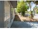 Property features a back porch and spacious yard with mature trees and a chain link fence at 1814 Leroy Dr, Haines City, FL 33844