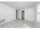 Spacious bedroom with tiled floors, a closet, and natural light from the window at 1814 Leroy Dr, Haines City, FL 33844