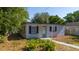 Charming single-story home featuring well-maintained landscaping and black shutters for added appeal at 1814 Leroy Dr, Haines City, FL 33844