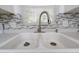 The kitchen features a stainless steel faucet and double basin sink with a window view at 1814 Leroy Dr, Haines City, FL 33844