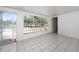Bright sunroom with large windows and sliding door, offering abundant natural light and outdoor access at 1814 Leroy Dr, Haines City, FL 33844