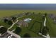 Aerial view of the community pool, clubhouse, dog park, and green spaces at 183 Flag Lilly Ln, Umatilla, FL 32784