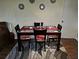 Inviting dining area with a modern table, chairs, and decorative accents for comfortable meal times at 1948 Lake Atriums Cir # 115, Orlando, FL 32839