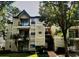 Attractive condo building featuring balconies and well-maintained landscaping, offering a welcoming exterior at 1948 Lake Atriums Cir # 115, Orlando, FL 32839