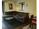 Cozy living room featuring a large sectional sofa, rug, and decorative wall hangings, creating an inviting space at 1948 Lake Atriums Cir # 115, Orlando, FL 32839