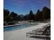 Outdoor pool and sunbathing loungers at 1948 Lake Atriums Cir # 115, Orlando, FL 32839