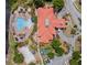 Aerial view of community clubhouse with pool, playground, sand volleyball court, and well-maintained landscaping at 209 Rosso Dr, Davenport, FL 33837