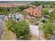 Community clubhouse with pool and playground sits on a lake, perfect for relaxation and recreation at 209 Rosso Dr, Davenport, FL 33837