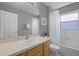 Bathroom featuring a vanity, toilet, shower and tub combination with a white shower curtain at 209 Rosso Dr, Davenport, FL 33837