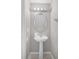 A quaint bathroom with a pedestal sink, oval mirror and neutral gray walls with white trim at 209 Rosso Dr, Davenport, FL 33837