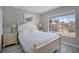 Bedroom with a white bed, matching lamps, and a window offering lots of natural light at 209 Rosso Dr, Davenport, FL 33837