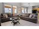 Inviting living room featuring tile flooring, large windows, and comfortable seating at 209 Rosso Dr, Davenport, FL 33837