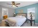 Main bedroom with a window, lamps and attached bathroom at 209 Rosso Dr, Davenport, FL 33837