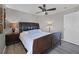 Bedroom featuring wood-look floors, a ceiling fan, and a large headboard at 209 Rosso Dr, Davenport, FL 33837