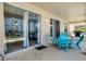 Covered patio featuring multiple seating areas and views into the house through the large sliding glass doors at 209 Rosso Dr, Davenport, FL 33837