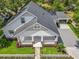 Beautiful aerial view of the house showcasing the well-maintained lawn and convenient carport at 217 W Bay St, Winter Garden, FL 34787