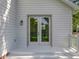 Elegant back entrance featuring double doors with glass panels and clean white siding at 217 W Bay St, Winter Garden, FL 34787
