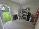 Basement with shelves with tools and equipment and a door that opens to the yard at 217 W Bay St, Winter Garden, FL 34787