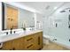 Modern bathroom with double sinks, granite countertops, and glass enclosed shower at 217 W Bay St, Winter Garden, FL 34787