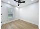 Bright bedroom features recessed lighting, modern ceiling fan, and light hardwood flooring at 217 W Bay St, Winter Garden, FL 34787
