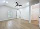 Spacious bedroom featuring hardwood floors, a ceiling fan, and ample natural light at 217 W Bay St, Winter Garden, FL 34787