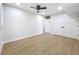 Modern bedroom with hardwood floors, ceiling fan, and ample closet space for comfortable living at 217 W Bay St, Winter Garden, FL 34787