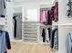 Walk-in closet with custom shelving, drawers, and natural light at 217 W Bay St, Winter Garden, FL 34787