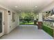 Covered outdoor area with a view of the yard, featuring recessed lighting and decorative brick supports at 217 W Bay St, Winter Garden, FL 34787