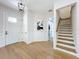 Inviting foyer with hardwood floors, staircase, and a stylish front door at 217 W Bay St, Winter Garden, FL 34787