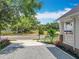 Home exterior with a gravel driveway, showcasing a lovely front yard, landscaping, and neighborhood views at 217 W Bay St, Winter Garden, FL 34787