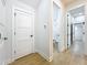 Bright hallway with multiple doorways and stylish, neutral-toned walls and trim at 217 W Bay St, Winter Garden, FL 34787