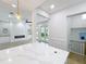 Open-concept living area featuring a fireplace, recessed lighting, and a view to the backyard at 217 W Bay St, Winter Garden, FL 34787